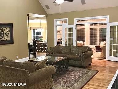9743 Lower Thomaston Road Macon, GA 31220 - Photo 6 of 28 a living room with furniture and a chandelier