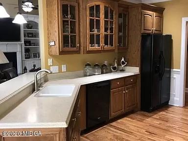 9743 Lower Thomaston Road Macon, GA 31220 - Photo 7 of 28 a kitchen with a sink and a refrigerator