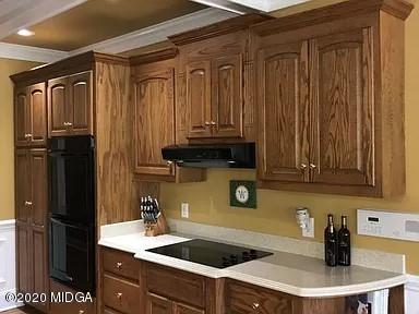 9743 Lower Thomaston Road Macon, GA 31220 - Photo 8 of 28 a kitchen with a sink and cabinets