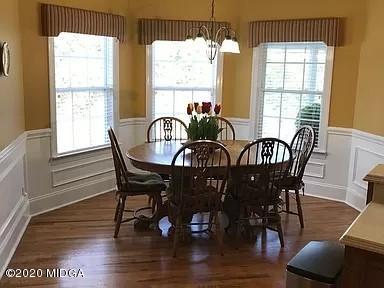 9743 Lower Thomaston Road Macon, GA 31220 - Photo 10 of 28 a view of a dining room with furniture window and wooden floor