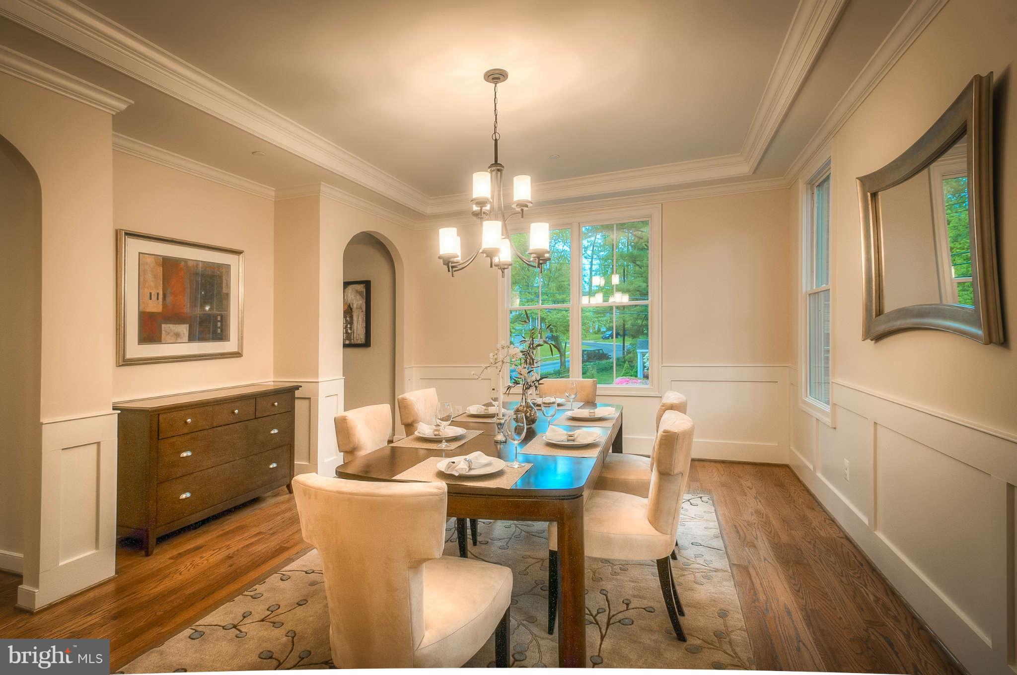 8700 Melwood Road Bethesda, MD 20817 - Photo 2 of 13 a living room with furniture and a chandelier