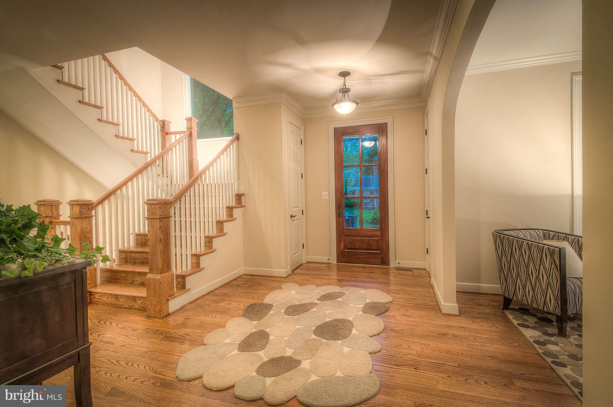 8700 Melwood Road Bethesda, MD 20817 - Photo 12 of 13 a view of a hallway with wooden floor and staircase