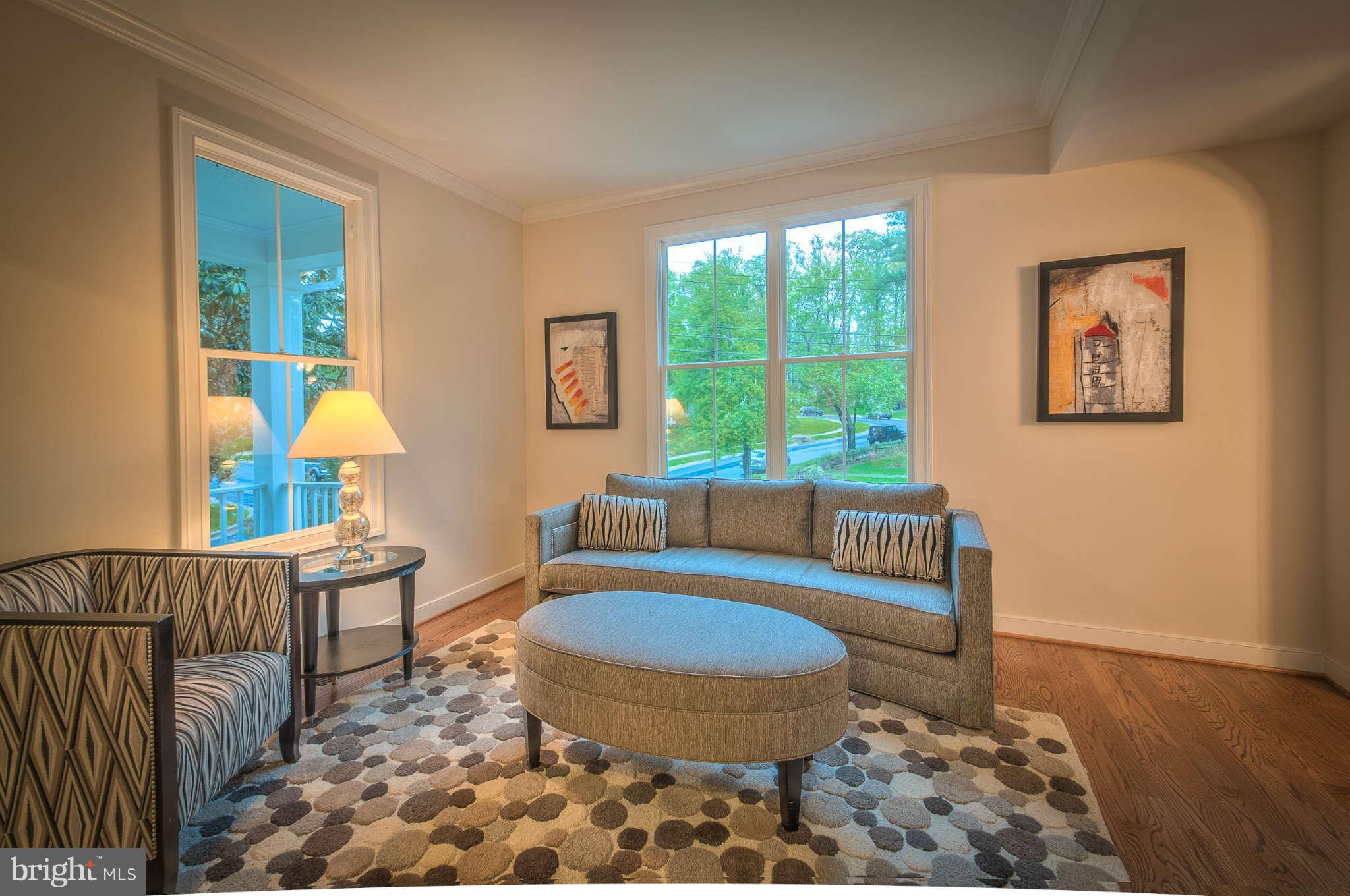 8700 Melwood Road Bethesda, MD 20817 - Photo 3 of 13 a living room with furniture and a table