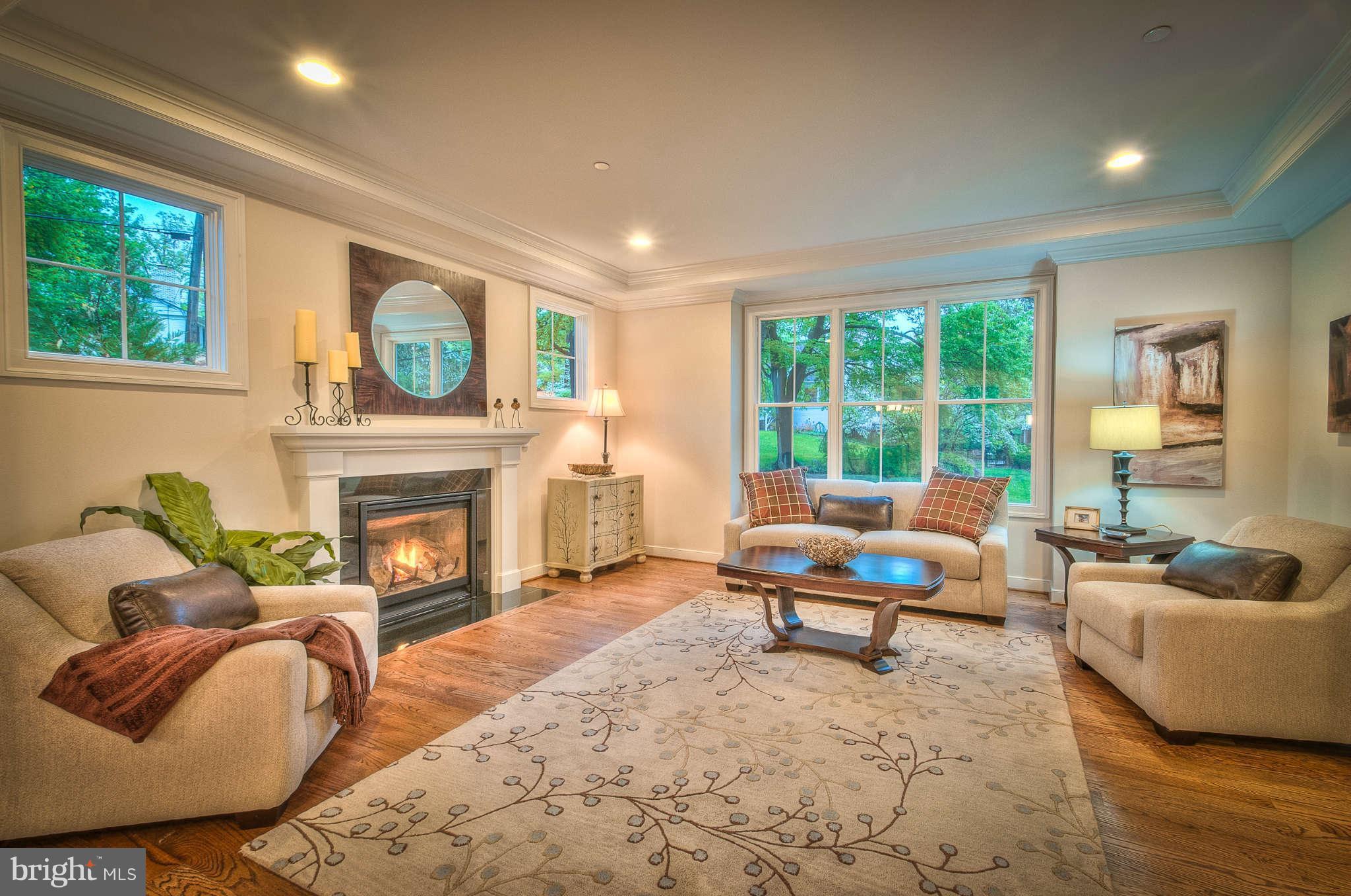 8700 Melwood Road Bethesda, MD 20817 - Photo 5 of 13 a living room with furniture and a fireplace