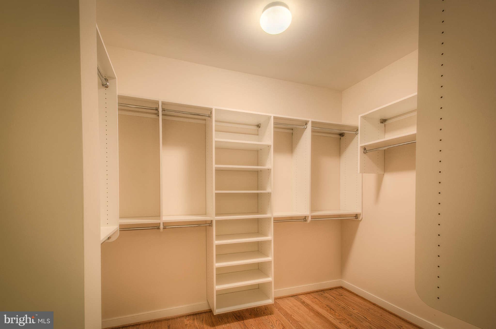8700 Melwood Road Bethesda, MD 20817 - Photo 9 of 13 a view of walk in closet with empty racks