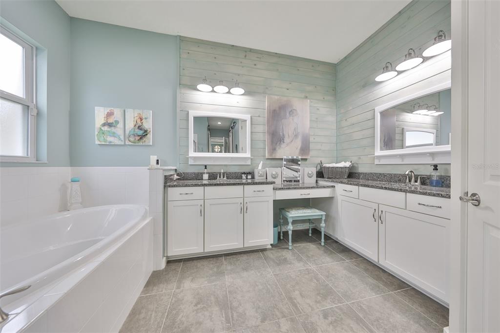 511 Winterside Drive Apollo Beach, FL 33572 - Photo 16 of 72 a bathroom with a granite countertop sink mirror and bathtub