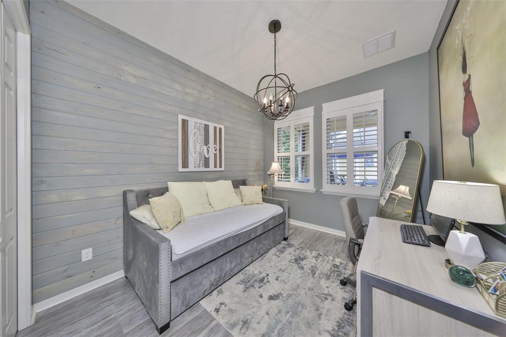 511 Winterside Drive Apollo Beach, FL 33572 - Photo 18 of 72 a living room with couch chandelier and a window