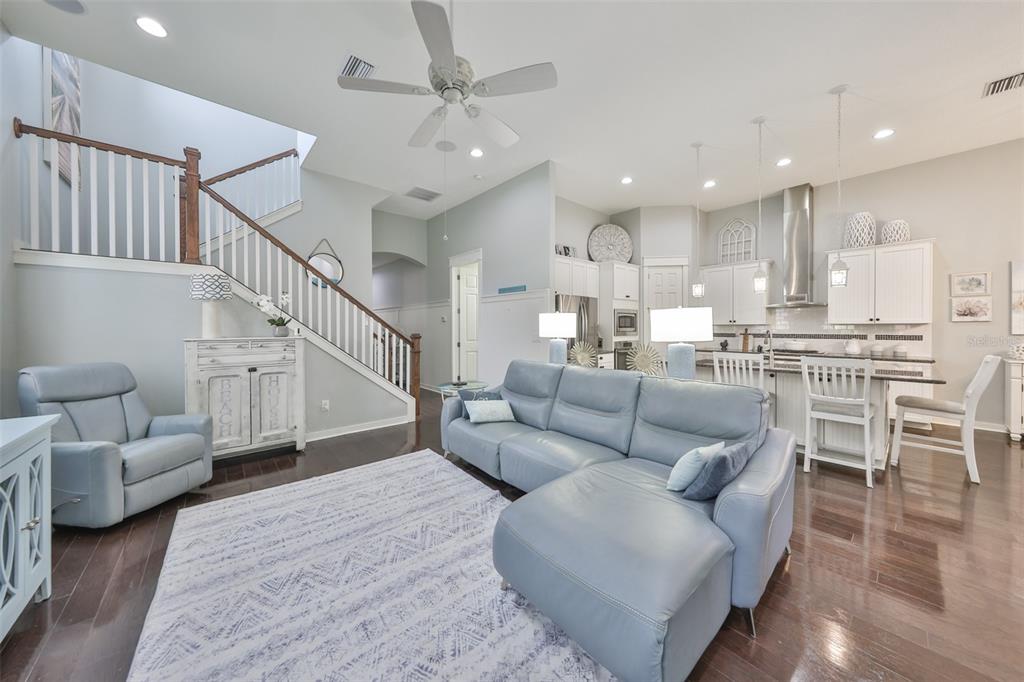 511 Winterside Drive Apollo Beach, FL 33572 - Photo 2 of 72 a living room with furniture and a dining table with wooden floor