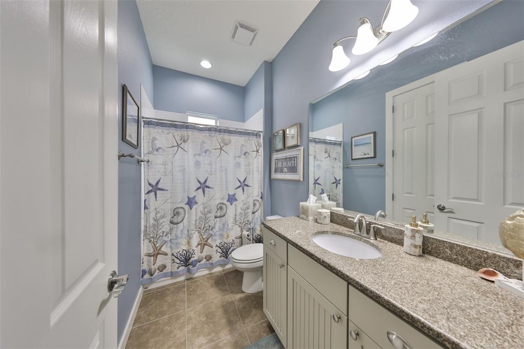 511 Winterside Drive Apollo Beach, FL 33572 - Photo 21 of 72 a bathroom with a granite countertop double vanity sink toilet and shower