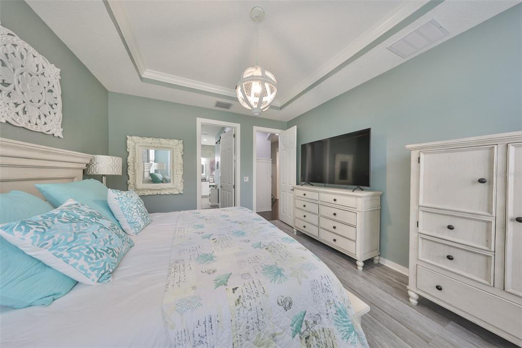 511 Winterside Drive Apollo Beach, FL 33572 - Photo 22 of 72 a bedroom with furniture and a flat screen tv