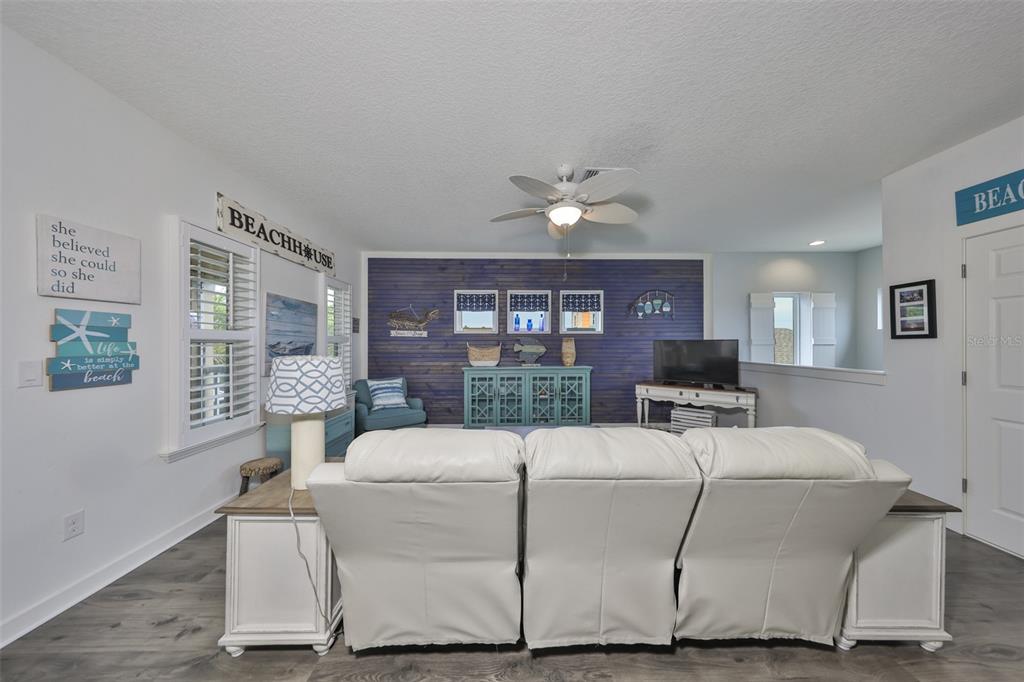 511 Winterside Drive Apollo Beach, FL 33572 - Photo 24 of 72 a living room with furniture a lamp and a large window