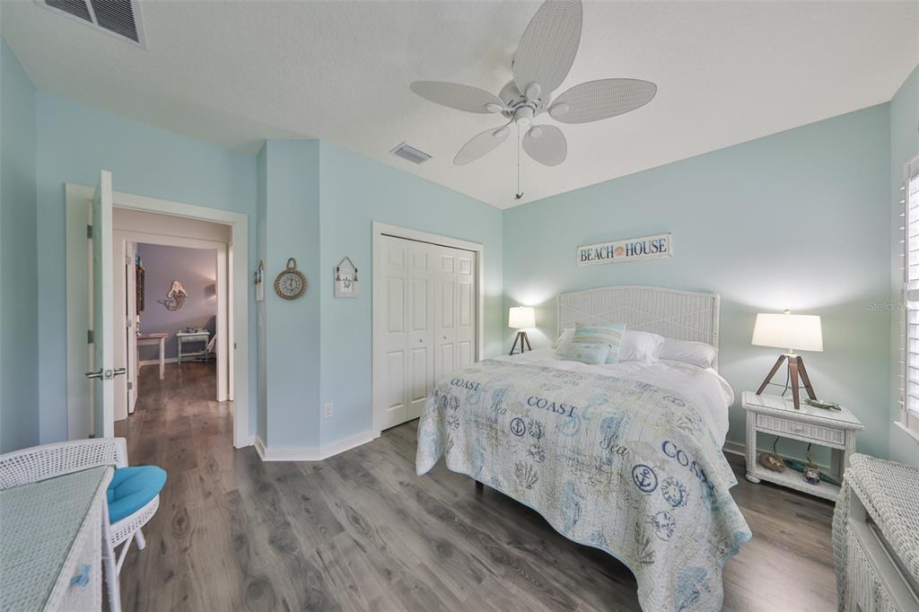 511 Winterside Drive Apollo Beach, FL 33572 - Photo 32 of 74 a bedroom with a bed and wooden floor