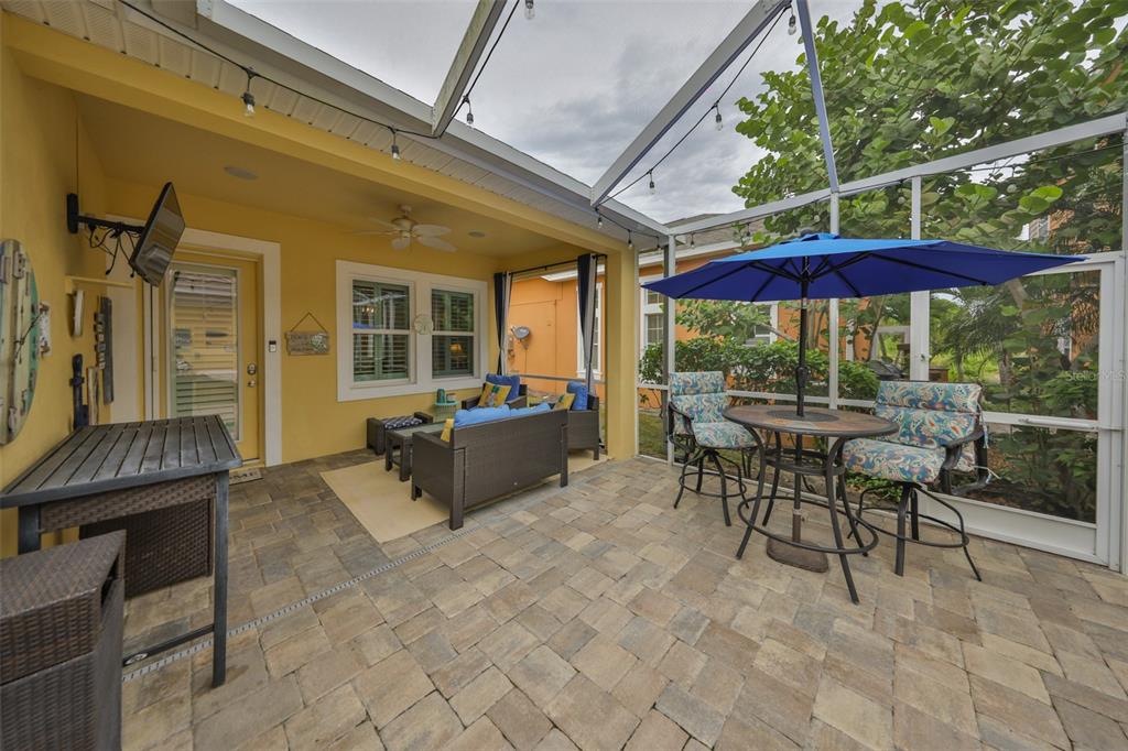 511 Winterside Drive Apollo Beach, FL 33572 - Photo 37 of 72 a view of a patio with a table and chairs under an umbrella