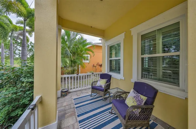 a kitchen with stainless steel appliances granite countertop a stove top oven a refrigerator a sink and white cabinets