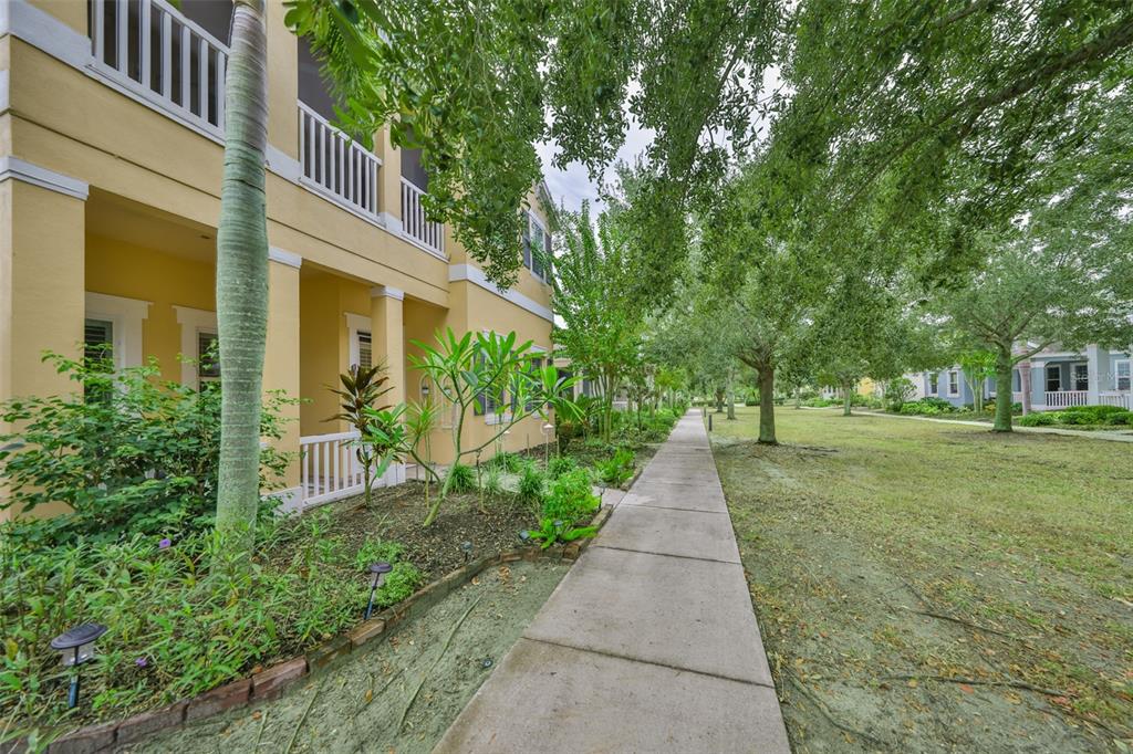 511 Winterside Drive Apollo Beach, FL 33572 - Photo 41 of 74 a view of a pathway with a house in the background