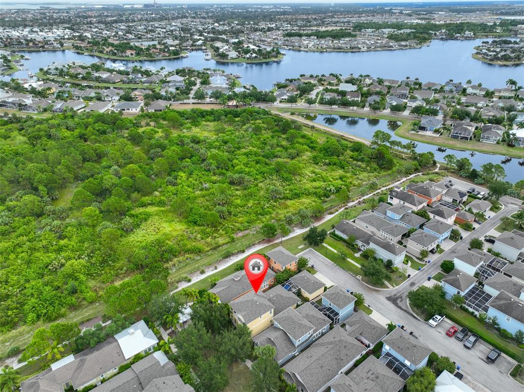 511 Winterside Drive Apollo Beach, FL 33572 - Photo 44 of 72 an aerial view of residential houses with outdoor space and trees