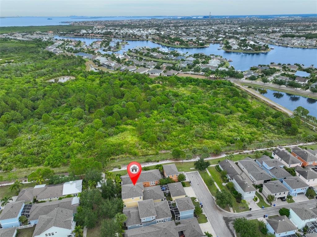 511 Winterside Drive Apollo Beach, FL 33572 - Photo 45 of 72 an aerial view of residential houses with outdoor space and trees