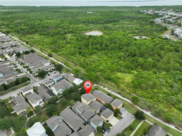 a view of a swimming pool with a table and chairs
