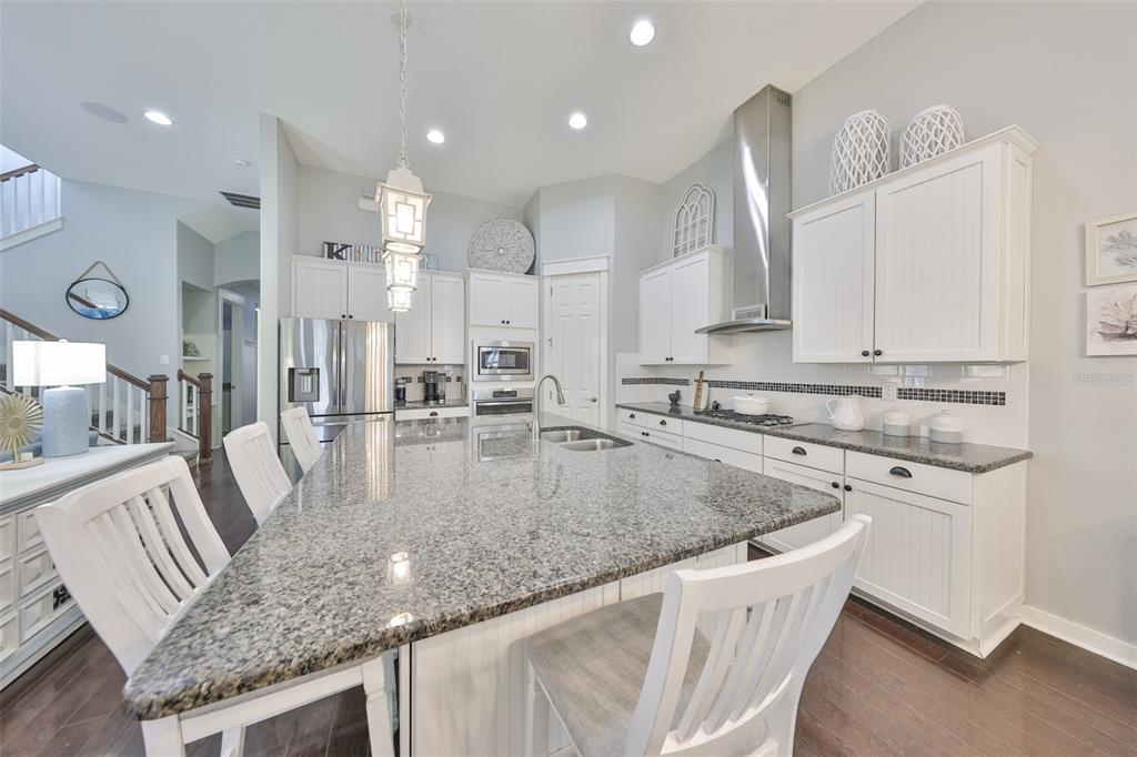 511 Winterside Drive Apollo Beach, FL 33572 - Photo 6 of 72 a view of a kitchen with kitchen island a sink appliances and a counter space