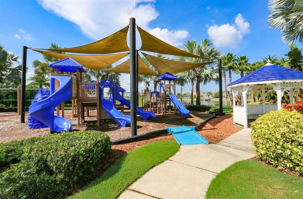 511 Winterside Drive Apollo Beach, FL 33572 - Photo 66 of 74 a view of a park with a slide and potted plants