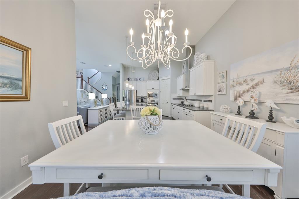 511 Winterside Drive Apollo Beach, FL 33572 - Photo 9 of 72 a kitchen with stainless steel appliances a table and chairs in it