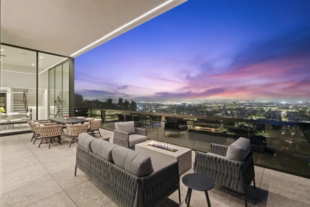 a view of walk in closet with clothes shoes and a washer dryer