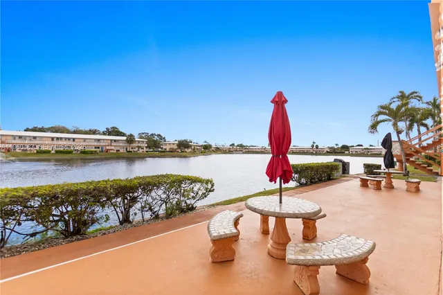 a view of multiple houses with a swimming pool