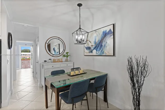 a view of a dining area with furniture and a chandelier