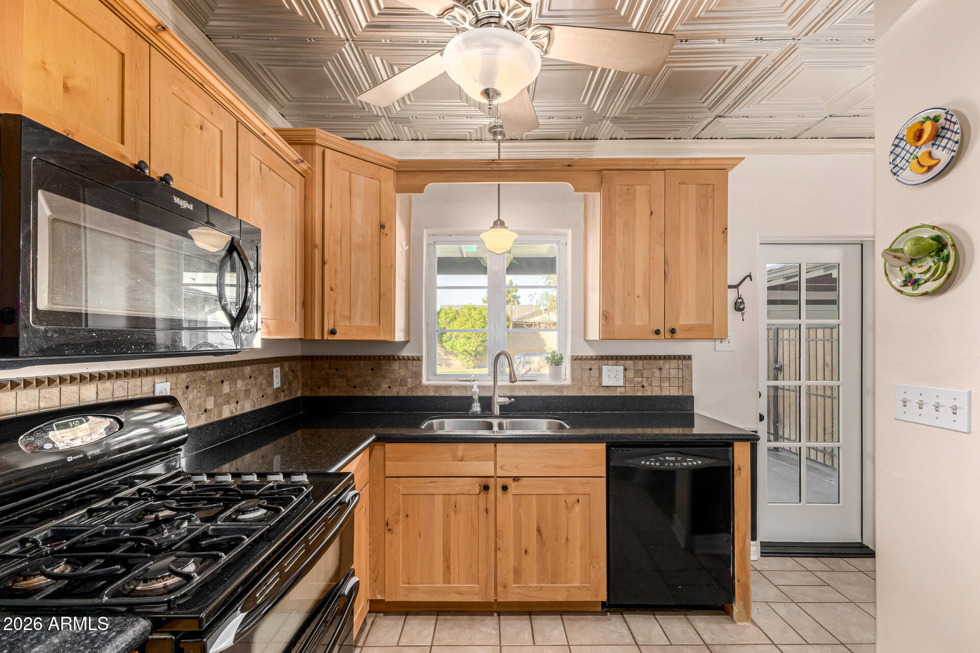 334 West Roma Avenue Phoenix, AZ 85013 - Photo 17 of 51 a kitchen with granite countertop a stove and a sink