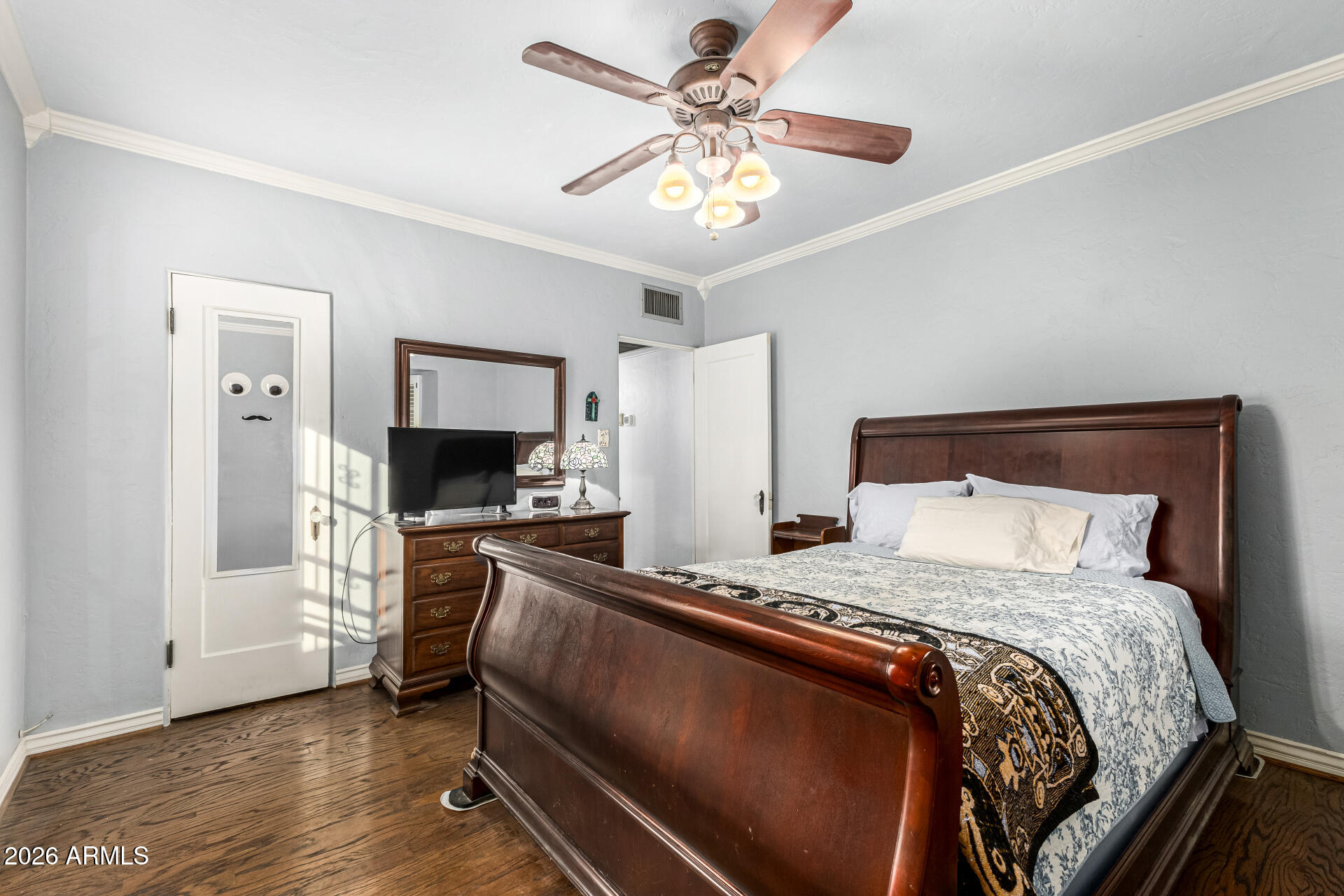 334 West Roma Avenue Phoenix, AZ 85013 - Photo 23 of 51 a bedroom with a bed and a chandelier