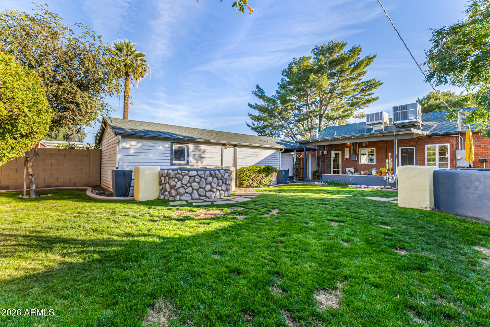 334 West Roma Avenue Phoenix, AZ 85013 - Photo 37 of 51 a view of a house with a yard and a large tree