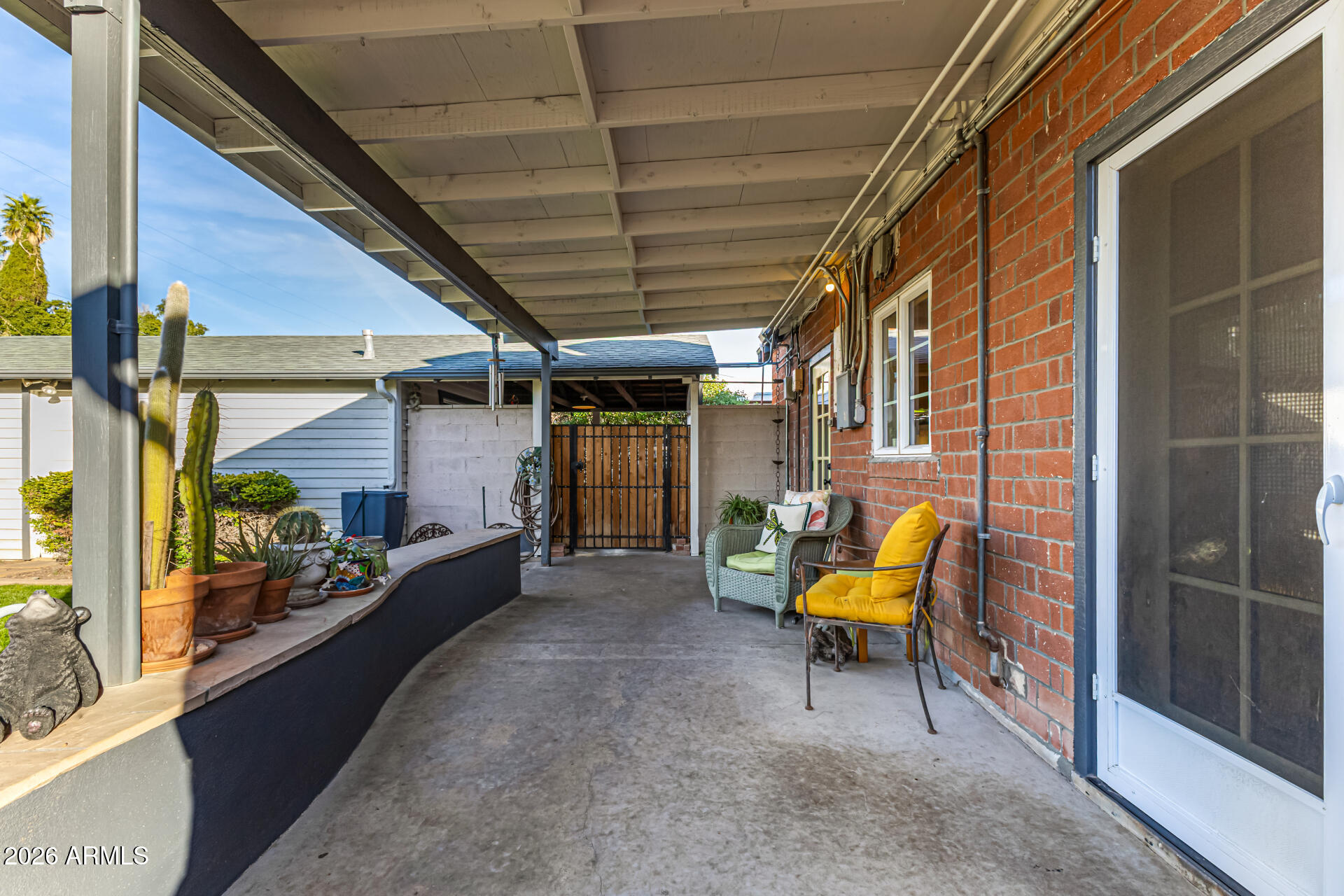 334 West Roma Avenue Phoenix, AZ 85013 - Photo 40 of 51 a view of a porch with furniture and a gate