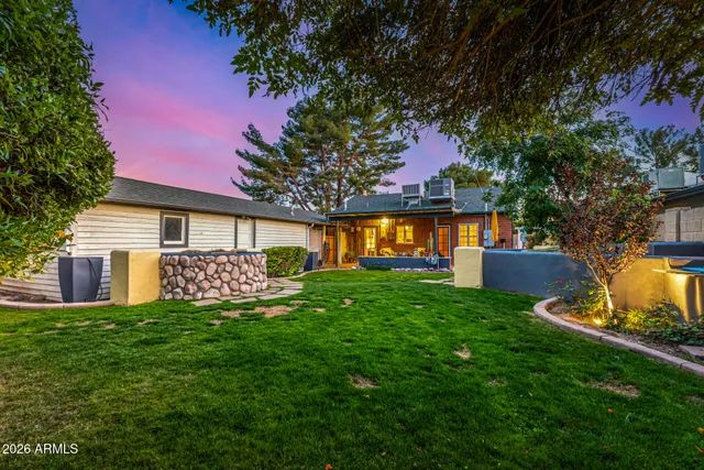 a bathroom with a bathtub shower sink and mirror