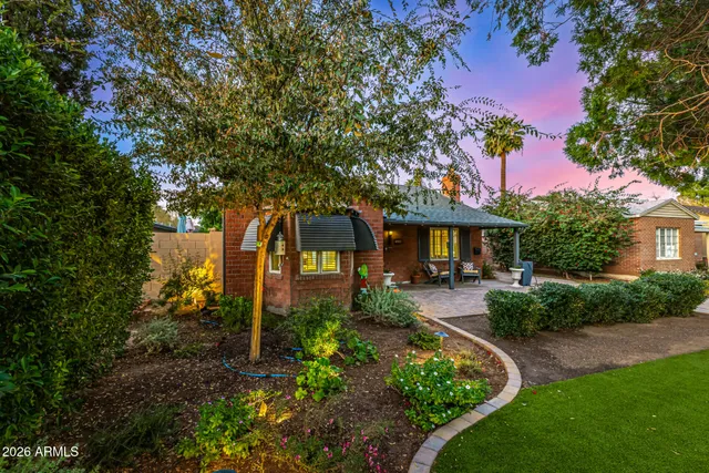 a front view of a house with garden