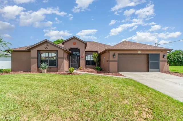a front view of a house with a garden and porch
