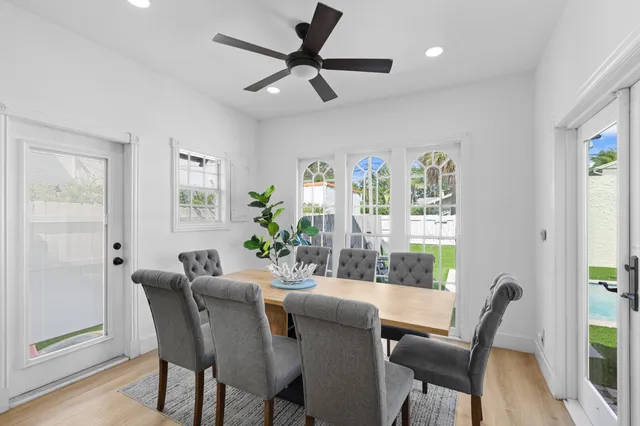 a dining room with furniture and window