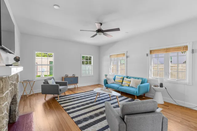 a bedroom with furniture and a window