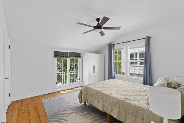 a bedroom with a large bed and a window