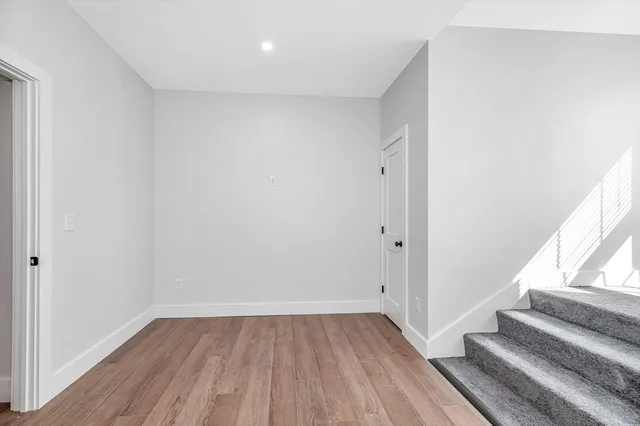 a view of entryway with wooden floor