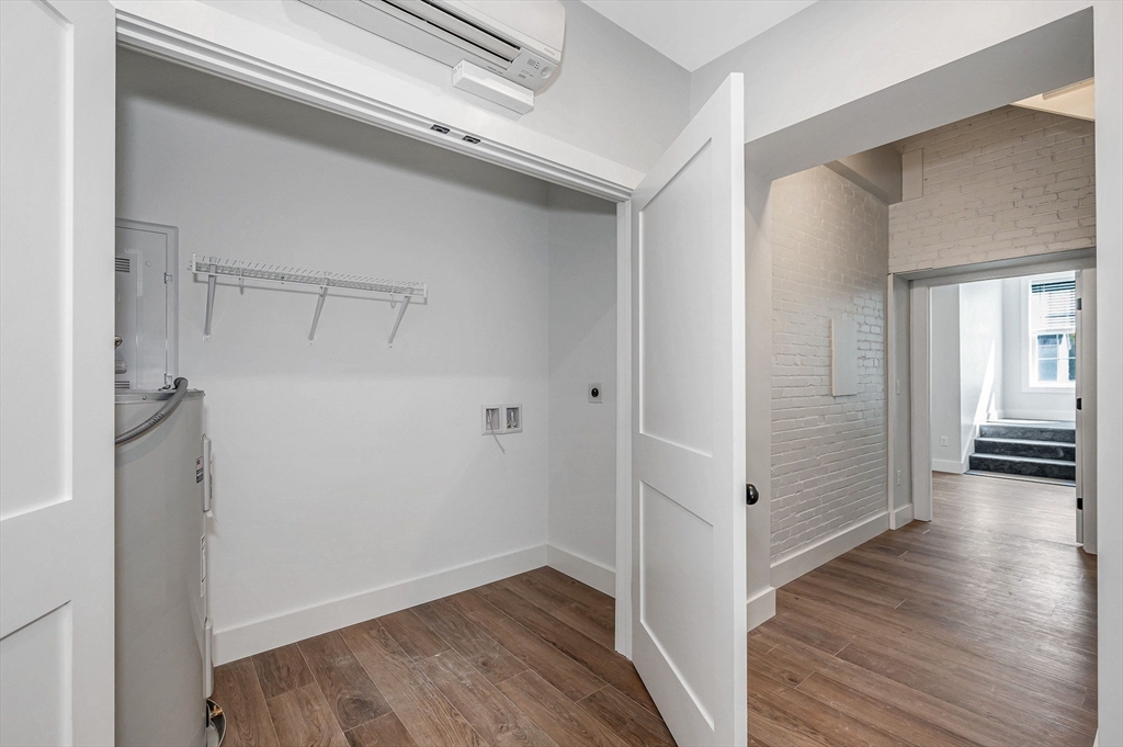 241 West 6th Street, Unit 102 Lowell, MA 01850 - Photo 15 of 25 a view of a hallway with wooden floor