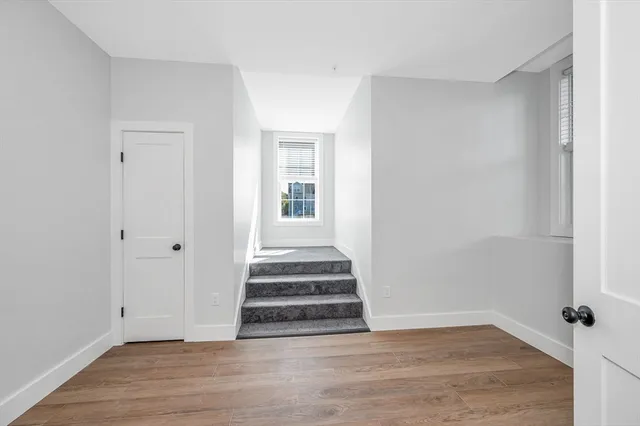 a view of entryway with wooden floor