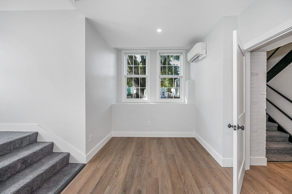 241 West 6th Street, Unit 102 Lowell, MA 01850 - Photo 18 of 25 a view of a room with wooden floor and window