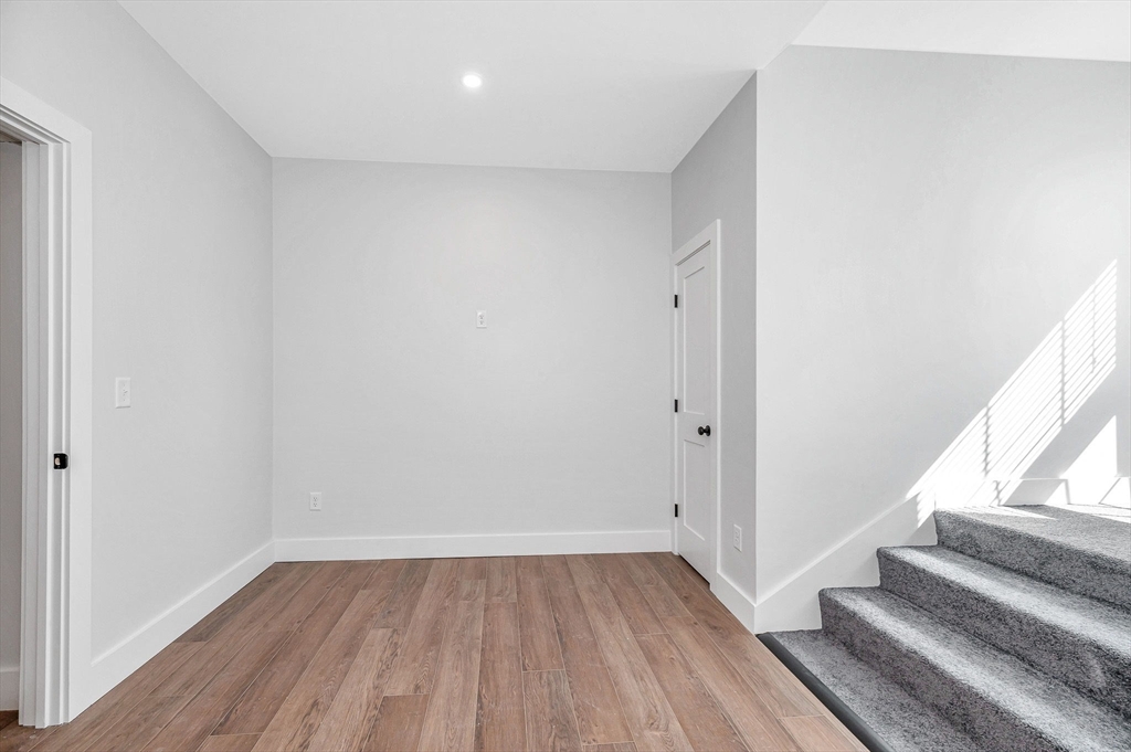 241 West 6th Street, Unit 102 Lowell, MA 01850 - Photo 20 of 25 a view of entryway with wooden floor