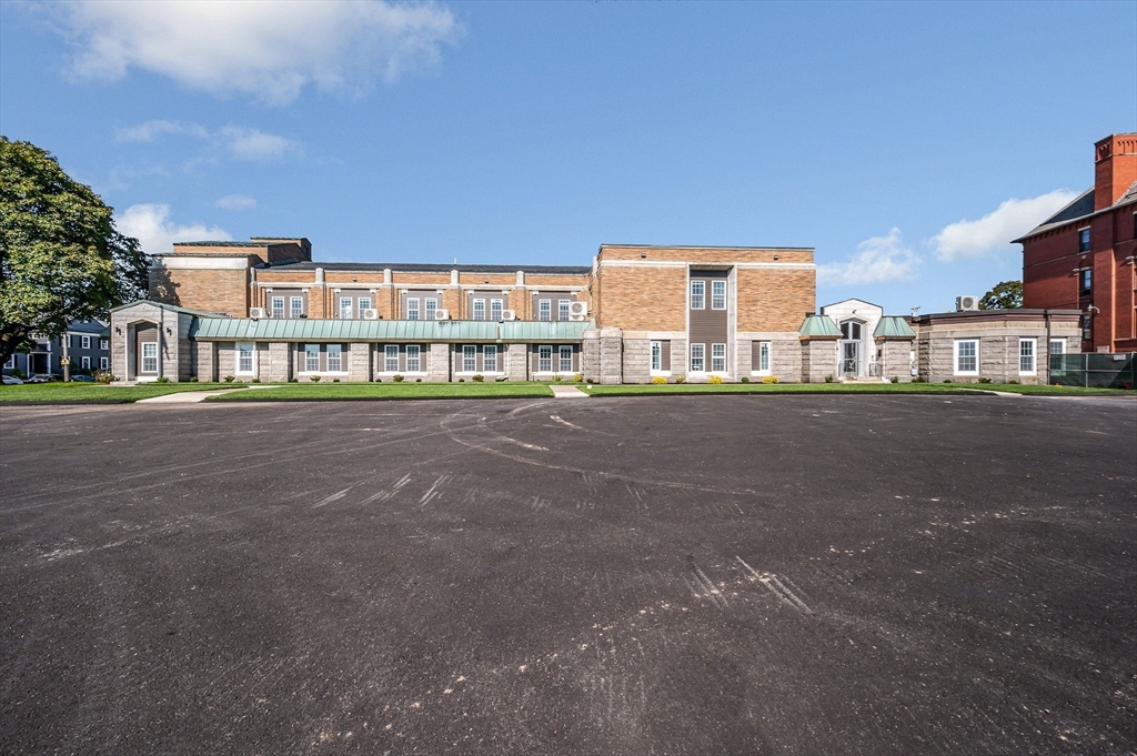 241 West 6th Street, Unit 102 Lowell, MA 01850 - Photo 24 of 25 a city view with tall buildings