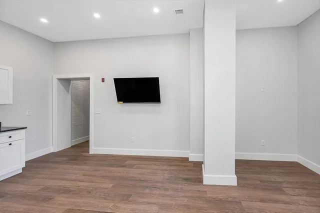 a view of a livingroom with wooden floor