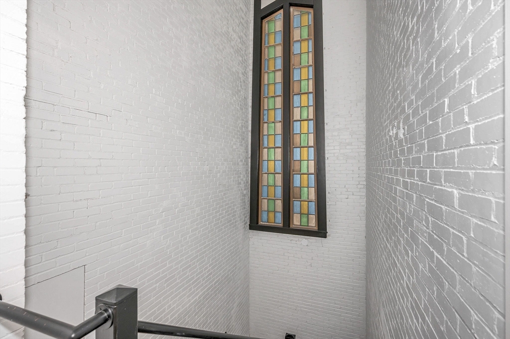 241 West 6th Street, Unit 102 Lowell, MA 01850 - Photo 8 of 25 a bathroom with a window and a shower