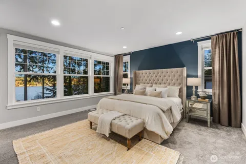 a bed room with a bed and a fireplace