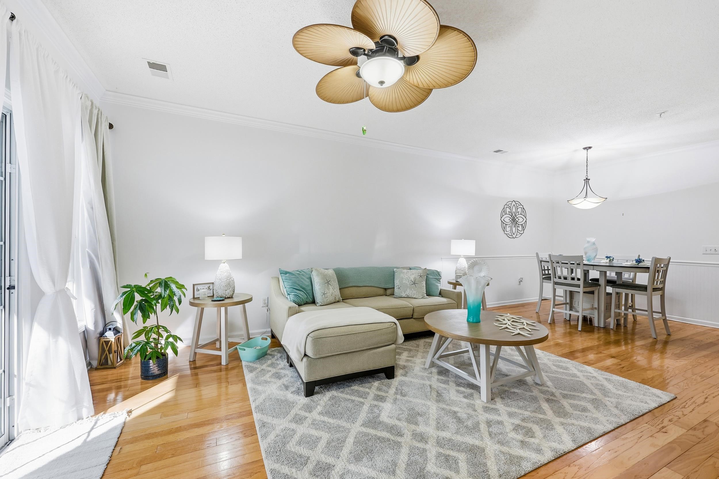 5870 Longwood Drive, Unit 203 Murrells Inlet, SC 29576 - Photo 19 of 32 Living room with light wood-type flooring and ornamental molding