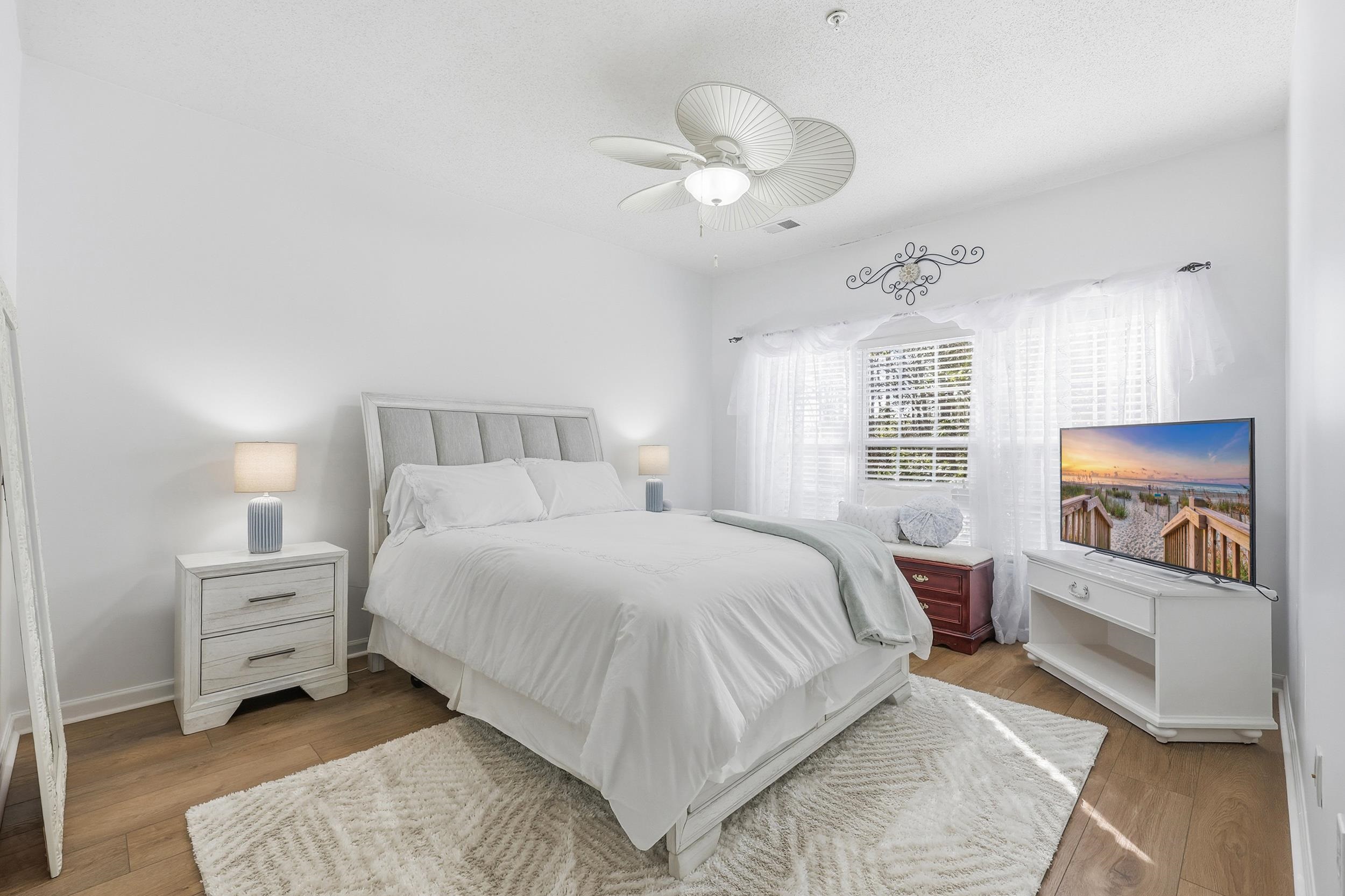 5870 Longwood Drive, Unit 203 Murrells Inlet, SC 29576 - Photo 20 of 32 Bedroom featuring light wood finished floors and ceiling fan