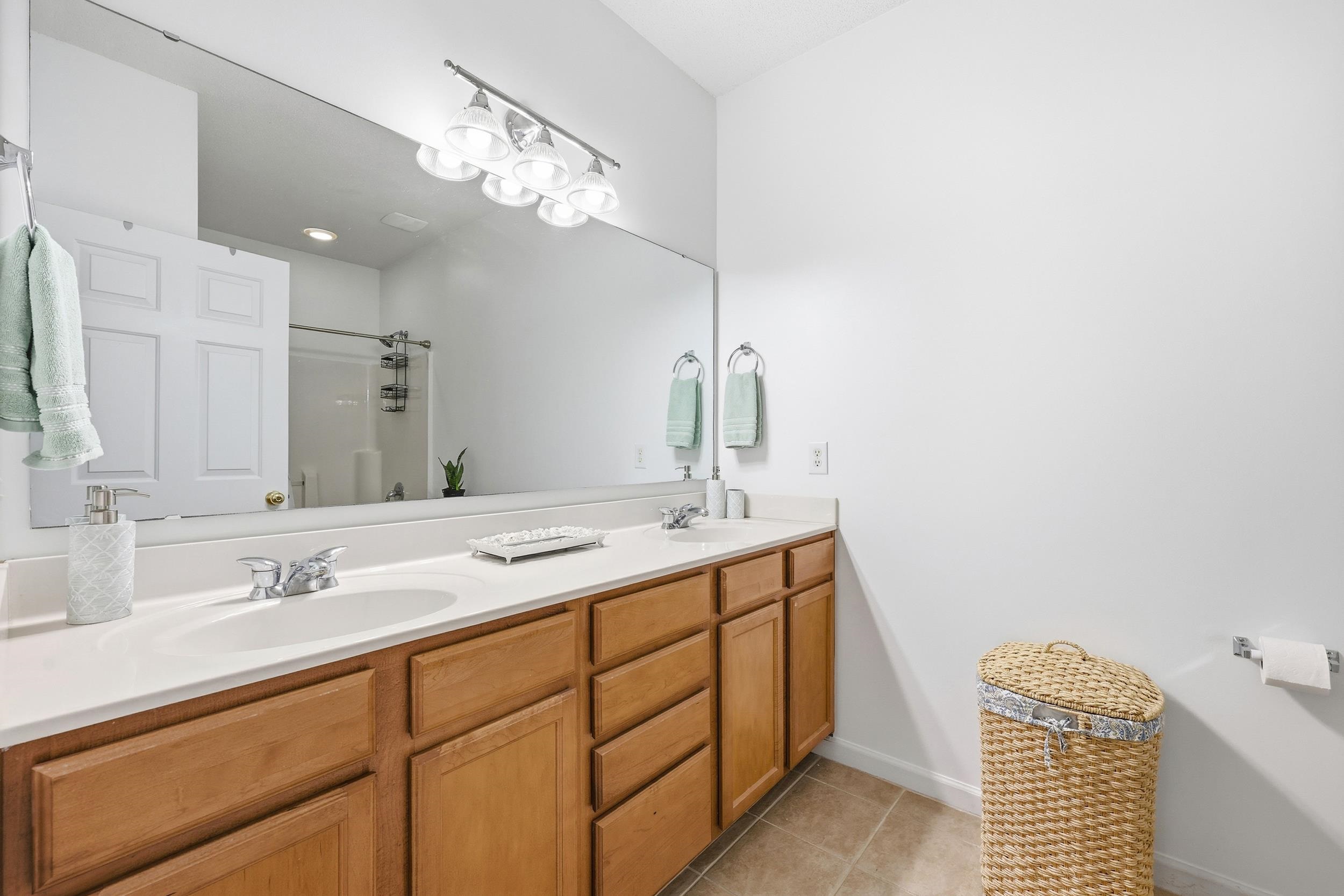 5870 Longwood Drive, Unit 203 Murrells Inlet, SC 29576 - Photo 22 of 32 Full bath with double vanity, a shower with door, and light tile patterned flooring